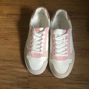Pink and white sneakers